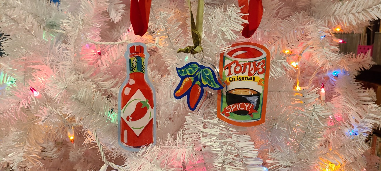 Spicy acrylic ornaments on a white Christmas tree