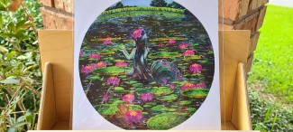 A mermaid in a swamp, surrounded by huge lilypads. She's holding up a frog.